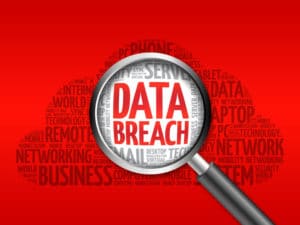 how much is a data breach claim worth illustrated with a word cloud and magnifying glass.